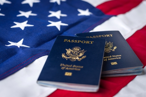 Two passports on a US flag.